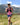 a woman running in the PS3 performance patella sleeve | OS1st