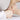 Hands massaging the top and arch of a bare foot during a foot treatment