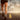 Runner's legs on an open asphalt road with a yellow center line